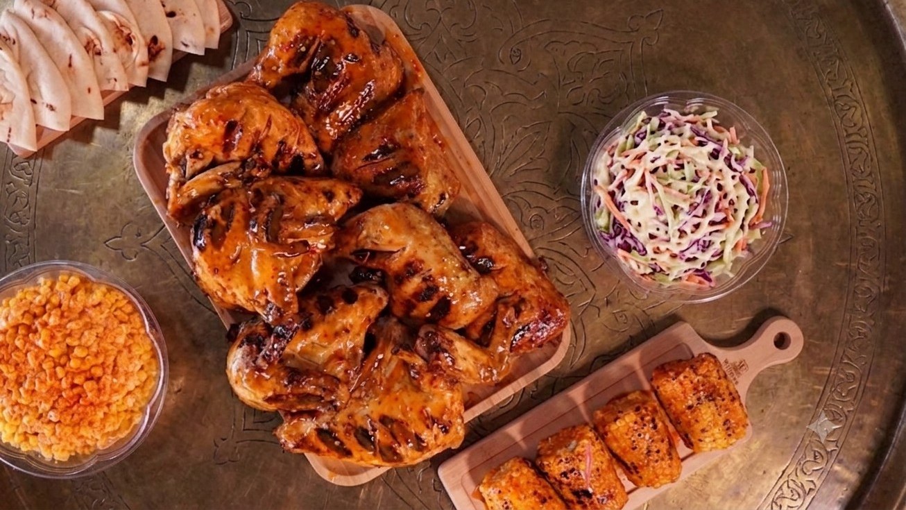 Halal peri peri whole chicken platter with coleslaw and pita