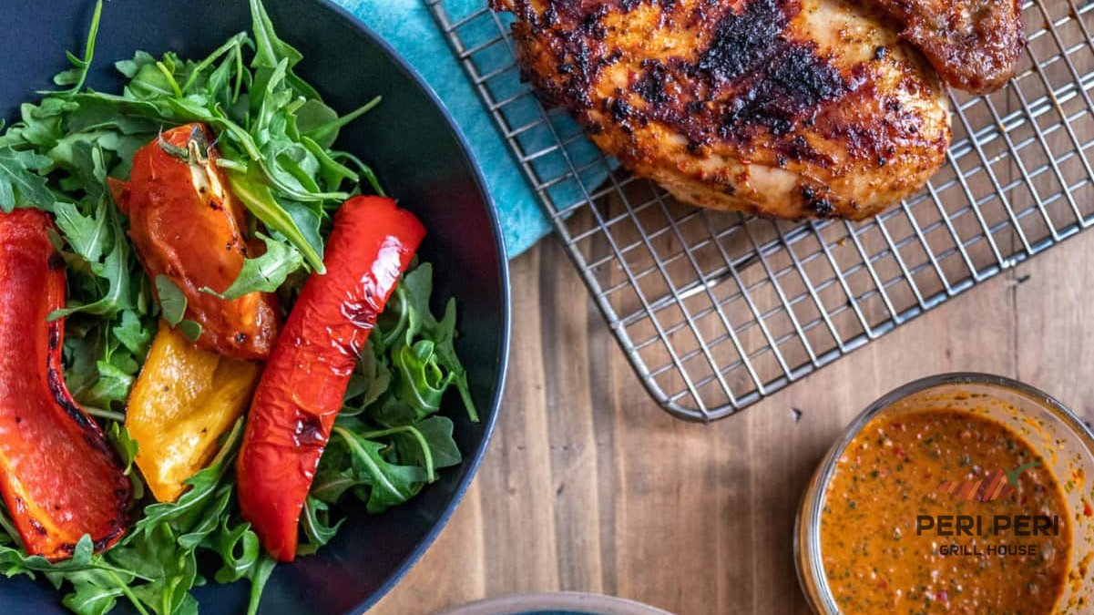 Flame-grilled halal peri peri chicken at Peri Peri Grill House